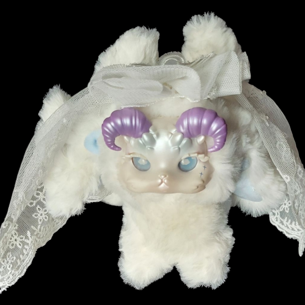 Cute Plush Toy with Purple Accents